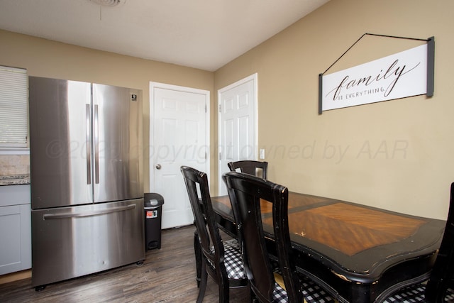 dining space with dark wood-style floors