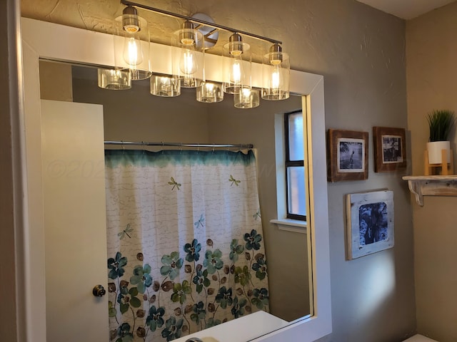 bathroom with a shower with curtain