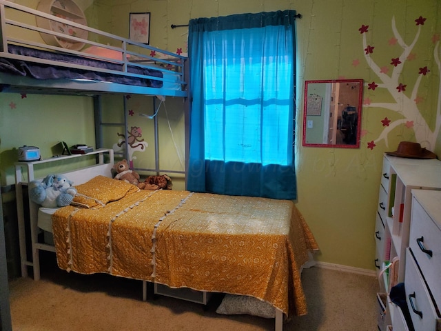 bedroom featuring baseboards