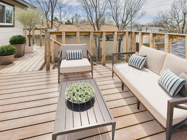 wooden terrace featuring an outdoor living space