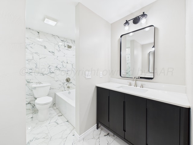 bathroom featuring marble finish floor, washtub / shower combination, toilet, and vanity