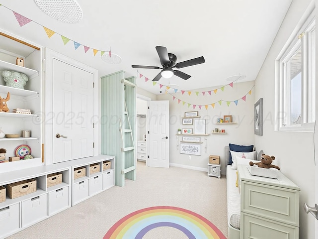recreation room featuring baseboards, carpet flooring, and ceiling fan