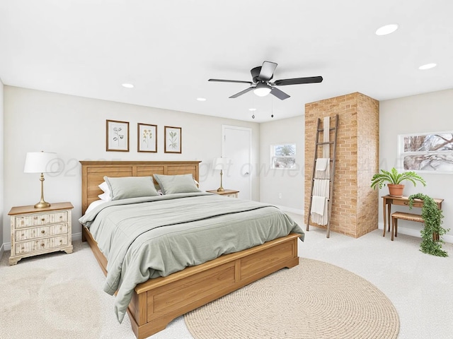bedroom featuring a ceiling fan, baseboards, light colored carpet, and recessed lighting
