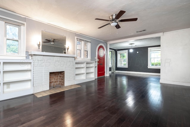 unfurnished living room featuring visible vents, a ceiling fan, baseboards, and hardwood / wood-style flooring
