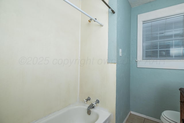 full bathroom featuring tile patterned flooring, vanity, toilet, baseboards, and tub / shower combination