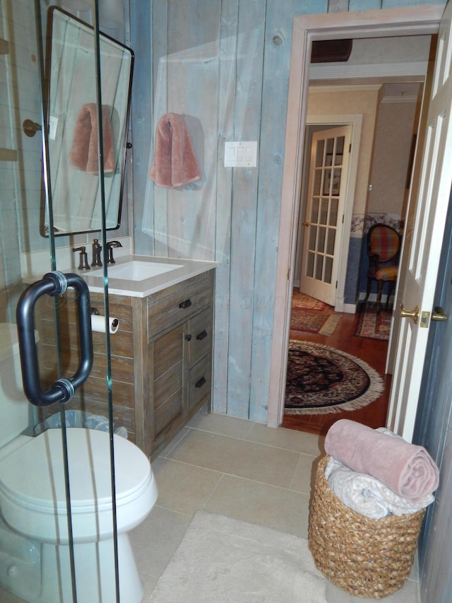 bathroom with tile patterned floors, toilet, and vanity