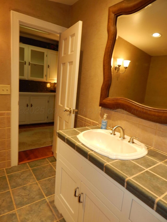 bathroom with tile patterned floors and vanity