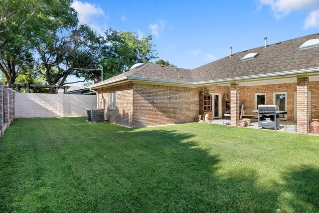 1918 Arroya Rd, Dalhart, TX 79022 - view of yard with central air condition unit, a patio area, and a fenced backyard