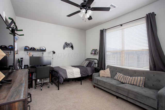 bedroom with ceiling fan and carpet flooring