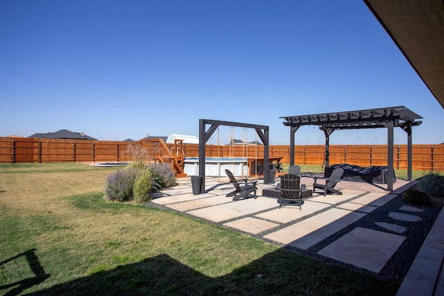 view of yard with a fire pit, a pergola, a fenced in pool, and a patio