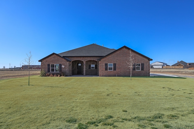 ranch-style house with a front yard