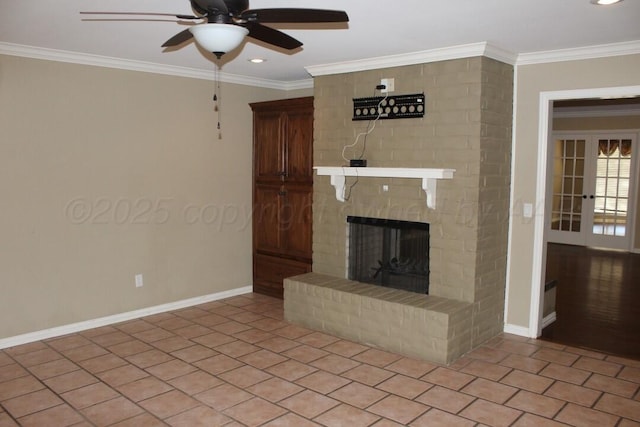 unfurnished living room with light tile patterned floors, baseboards, a fireplace, and ornamental molding