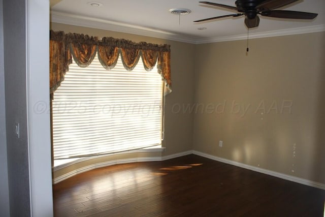 spare room featuring a ceiling fan, crown molding, baseboards, and wood finished floors