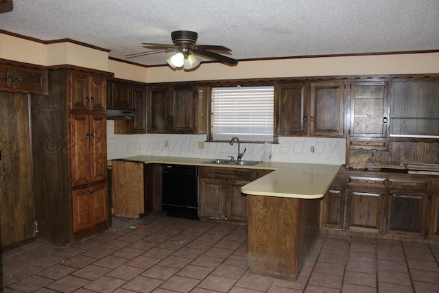 kitchen with light tile patterned floors, under cabinet range hood, a peninsula, a sink, and black dishwasher