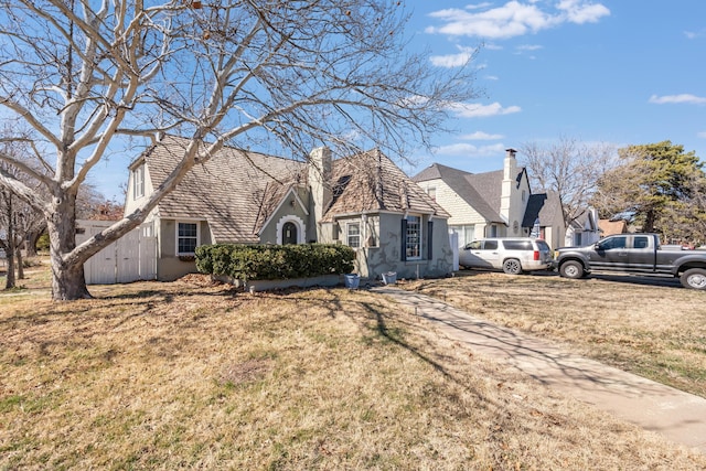 view of front of property with a front lawn and stucco siding