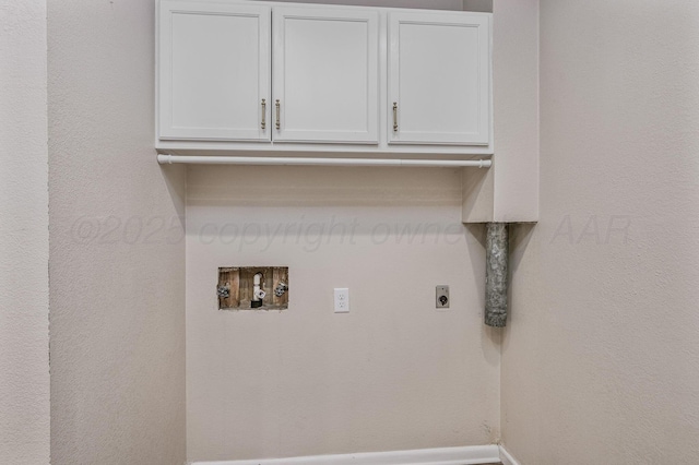 clothes washing area featuring washer hookup, cabinet space, and electric dryer hookup