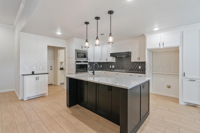 7912 Pensacola Ave, Amarillo, TX 79118 - kitchen with visible vents, white cabinetry, tasteful backsplash, a sink, and appliances with stainless steel finishes