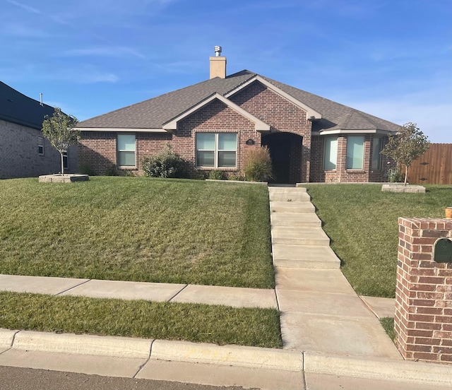 single story home featuring a front yard