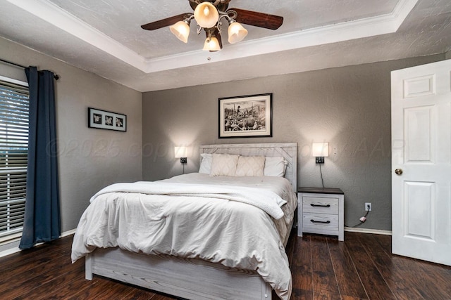 4208 Alamo Rd, Amarillo, TX 79110 - bedroom featuring a raised ceiling, hardwood / wood-style flooring, baseboards, a textured wall, and crown molding