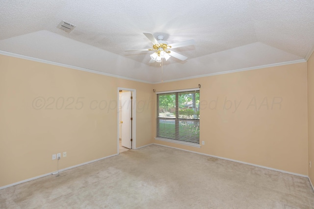 empty room with ceiling fan, light colored carpet, baseboards, crown molding, and a textured ceiling