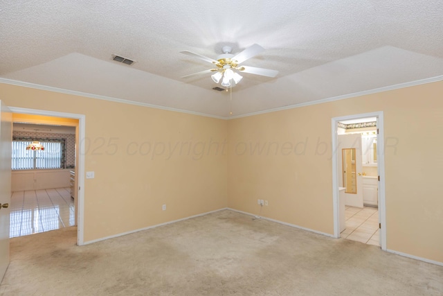 unfurnished bedroom featuring crown molding, carpet flooring, baseboards, a textured ceiling, and tile patterned floors