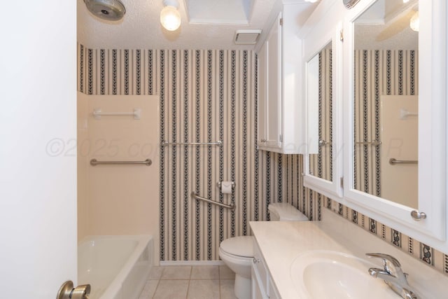 bathroom featuring wallpapered walls, toilet, tile patterned floors, a textured ceiling, and vanity