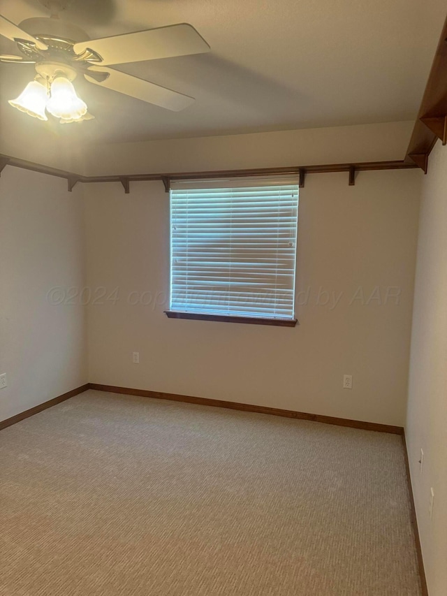 carpeted empty room with ceiling fan