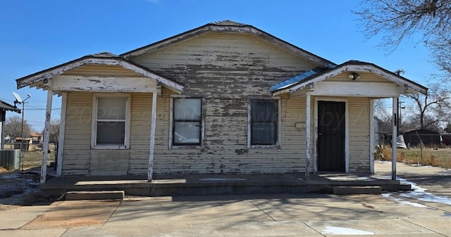 view of front facade with a patio and central AC unit