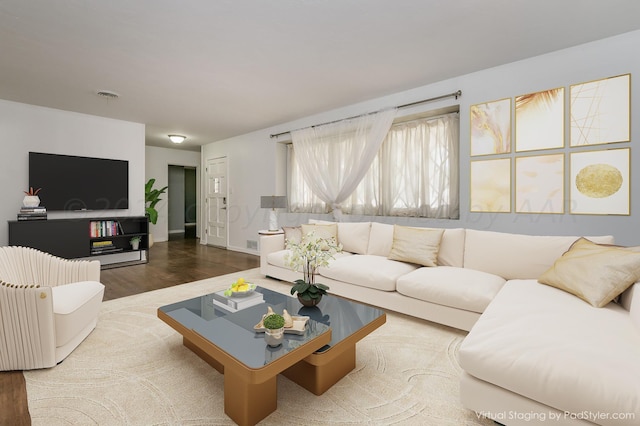 living area featuring wood finished floors and visible vents