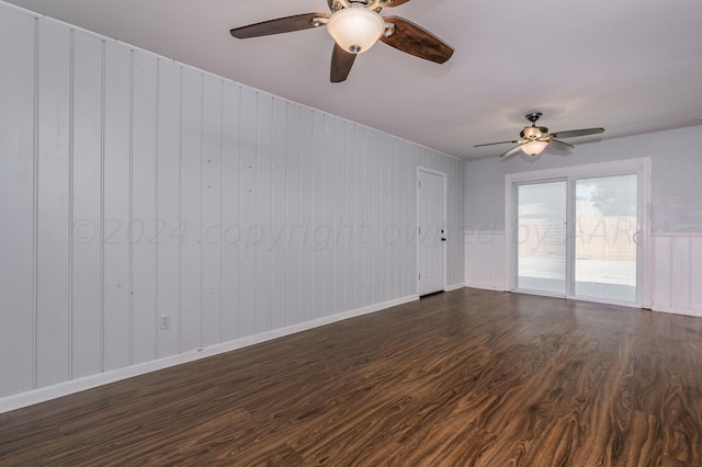 unfurnished room with dark wood-type flooring and ceiling fan