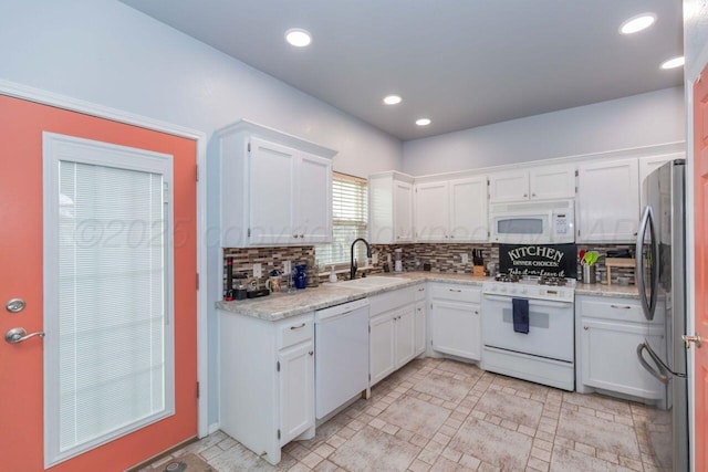 6205 S Bonham St, Amarillo, TX 79118 - kitchen featuring white appliances, white cabinetry, decorative backsplash, light countertops, and recessed lighting