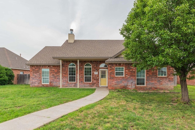 6205 S Bonham St, Amarillo, TX 79118 - view of front facade with brick siding, roof with shingles, and a chimney