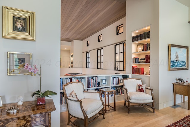 sitting room with wooden ceiling and light hardwood / wood-style floors