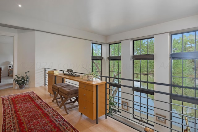 office area with light hardwood / wood-style floors