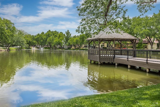 view of dock with a water view and a gazebo