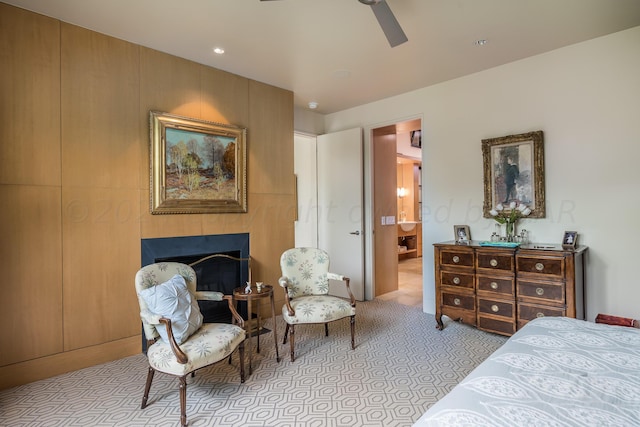 bedroom featuring ensuite bathroom and ceiling fan