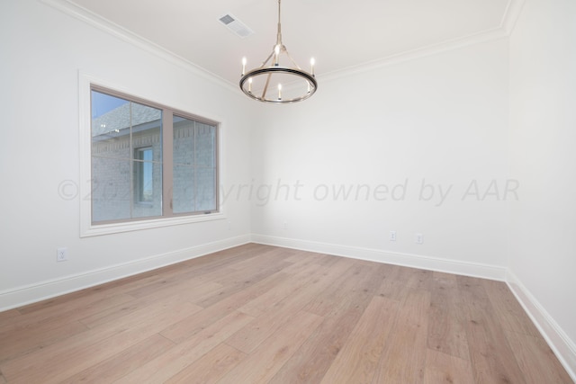empty room with visible vents, crown molding, baseboards, a chandelier, and light wood-style flooring