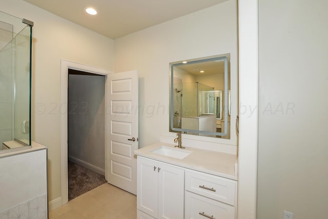 bathroom featuring vanity, tile patterned floors, and an enclosed shower