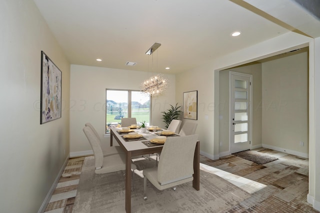dining area with a notable chandelier