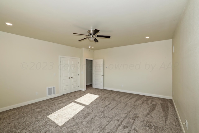 unfurnished bedroom with carpet flooring and ceiling fan