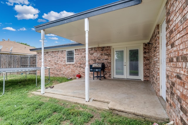 6308 Dartmouth St, Amarillo, TX 79109 - view of patio featuring a trampoline, french doors, and area for grilling