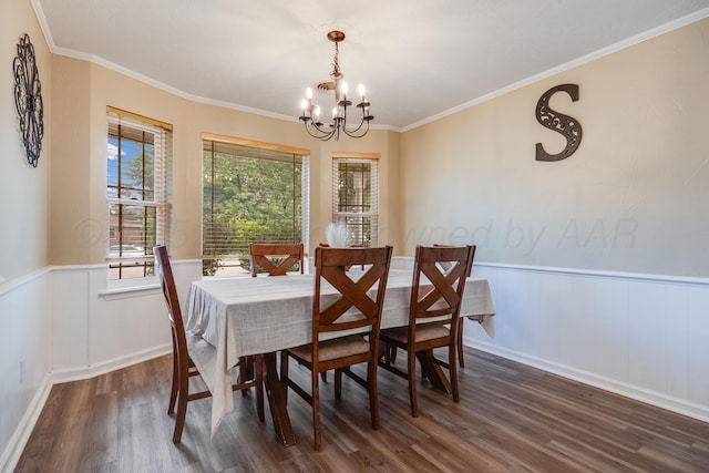 6308 Dartmouth St, Amarillo, TX 79109 - dining space featuring a chandelier, wood finished floors, a wainscoted wall, and ornamental molding