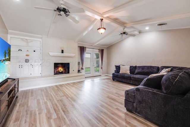 6308 Dartmouth St, Amarillo, TX 79109 - living area with ceiling fan, light wood-style floors, a brick fireplace, and baseboards