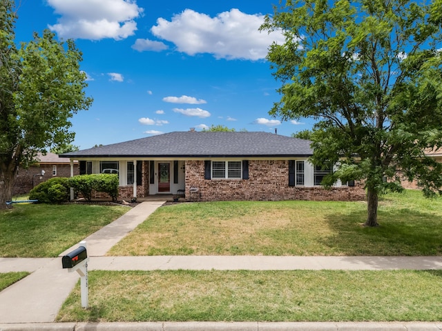 6308 Dartmouth St, Amarillo, TX 79109 - ranch-style home featuring a front lawn, brick siding, and a shingled roof