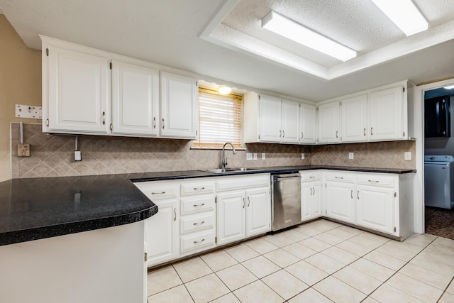 6308 Dartmouth St, Amarillo, TX 79109 - kitchen featuring a sink, washer / clothes dryer, stainless steel dishwasher, and dark countertops