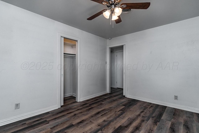 unfurnished bedroom with dark wood-style flooring, a closet, a ceiling fan, visible vents, and baseboards