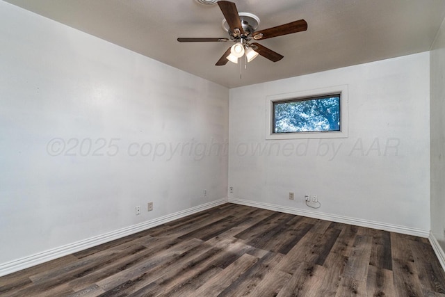 spare room featuring baseboards, a ceiling fan, and dark wood-type flooring