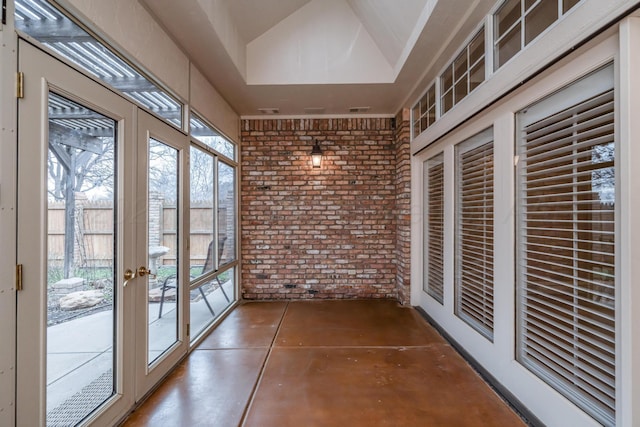 unfurnished sunroom with a healthy amount of sunlight and french doors
