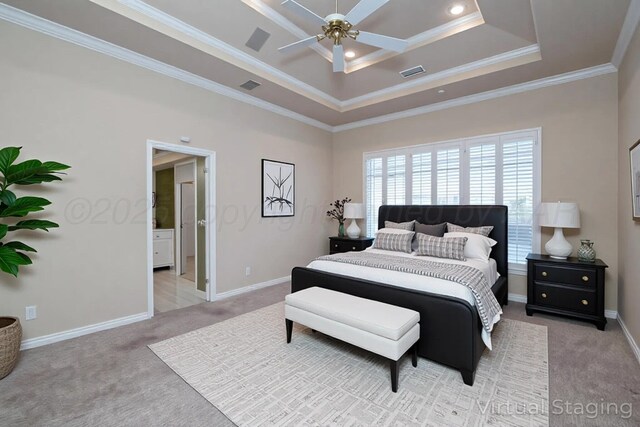 bedroom featuring visible vents, ornamental molding, light colored carpet, and a tray ceiling