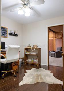 110 Dallam Ave, Dumas, TX 79029 - home office with a ceiling fan and wood finished floors